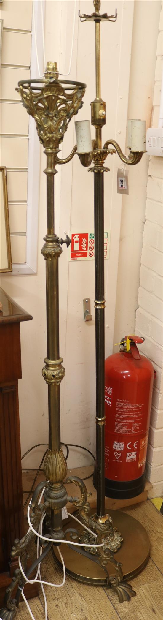 Two late Victorian telescopic brass lamp standards Width of bases 43 and 33cm
